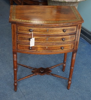 A Regency brass inlaid rosewood bowfront drop leaf work table, width 54cm, depth 36cm, height 70cm